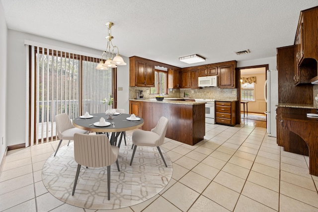 32 Woodmont Rd, Avon, CT 06001 - kitchen with white appliances, decorative backsplash, plenty of natural light, and a textured ceiling