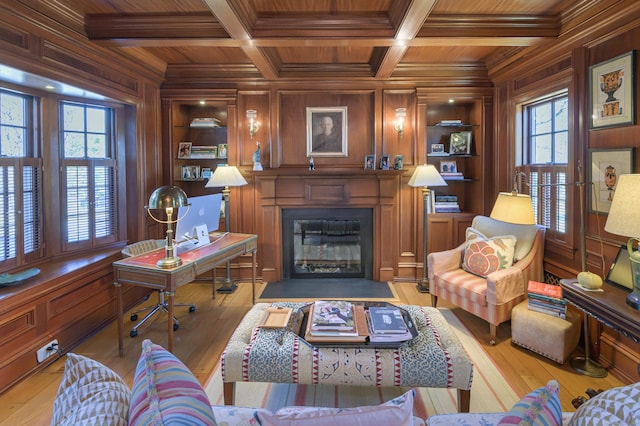 living room with ornamental molding, wood walls, wood ceiling, and built in shelves