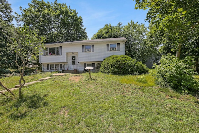 bi-level home with a front lawn