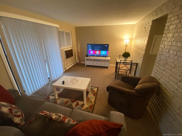 carpeted living area with brick wall and a baseboard radiator