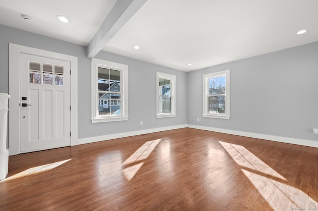 foyer featuring recessed lighting, baseboards, beam ceiling, and wood finished floors