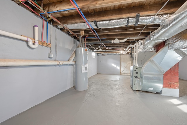 unfinished below grade area featuring water heater