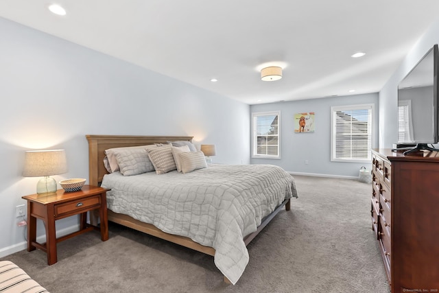 carpeted bedroom featuring recessed lighting and baseboards