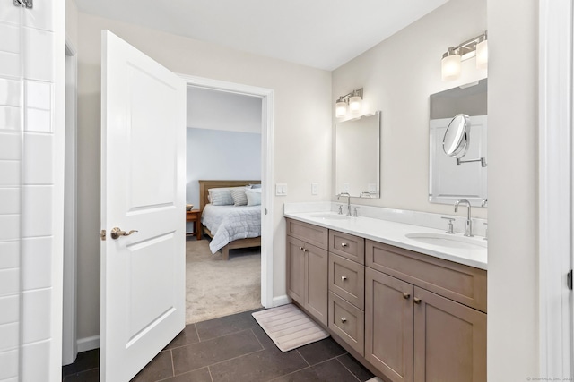 full bathroom featuring a sink, ensuite bathroom, double vanity, and tile patterned flooring