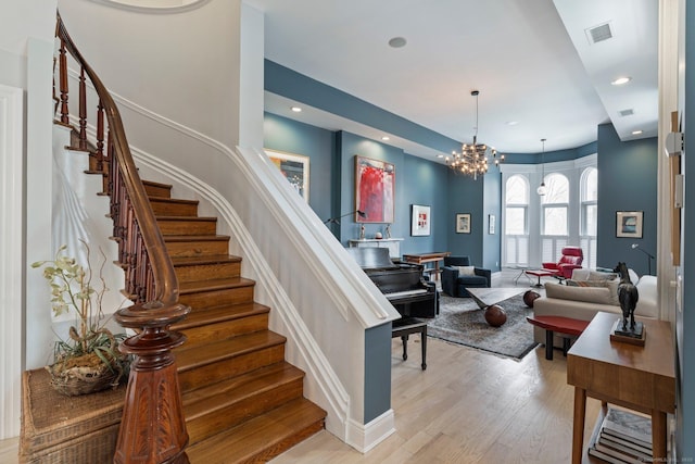 93 Elm St, Hartford, CT 06106 - staircase with visible vents, baseboards, an inviting chandelier, recessed lighting, and wood finished floors