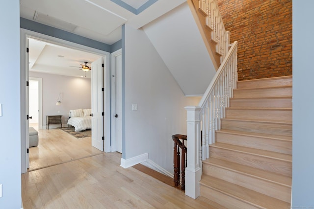 93 Elm St, Hartford, CT 06106 - stairway featuring wood finished floors, brick wall, and ceiling fan