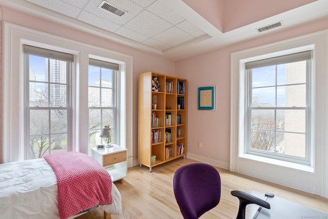 93 Elm St, Hartford, CT 06106 - bedroom with light wood-style floors and a drop ceiling
