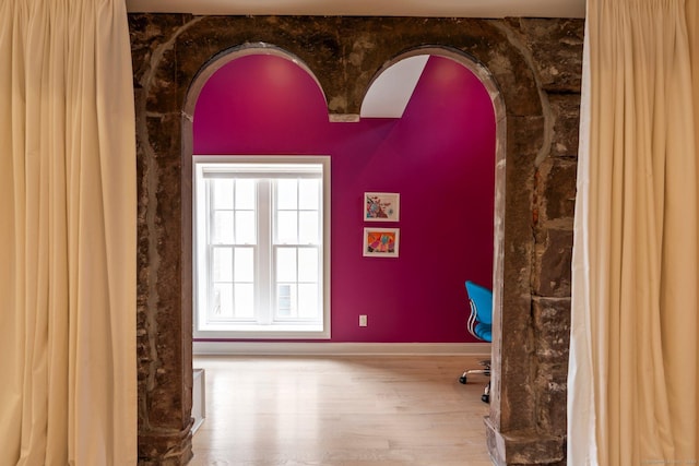 93 Elm St, Hartford, CT 06106 - empty room with wood finished floors, baseboards, and arched walkways