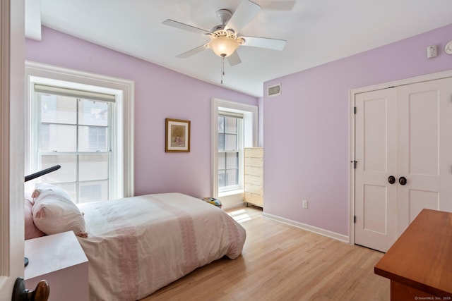 93 Elm St, Hartford, CT 06106 - bedroom featuring light wood-type flooring, ceiling fan, and a closet