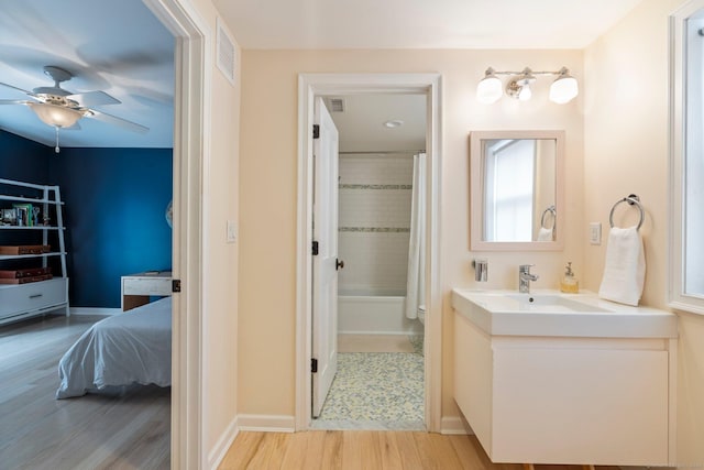 93 Elm St, Hartford, CT 06106 - bathroom featuring vanity, ceiling fan, wood finished floors, shower / tub combo, and connected bathroom