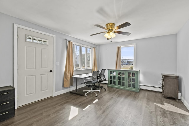 office with ceiling fan, plenty of natural light, baseboard heating, and wood finished floors