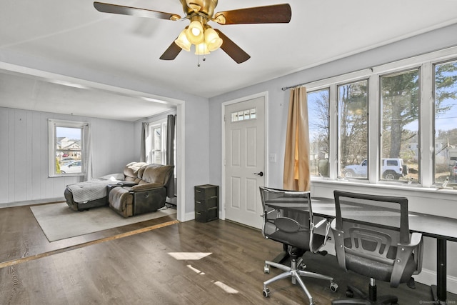 office area featuring wood finished floors, baseboards, and ceiling fan