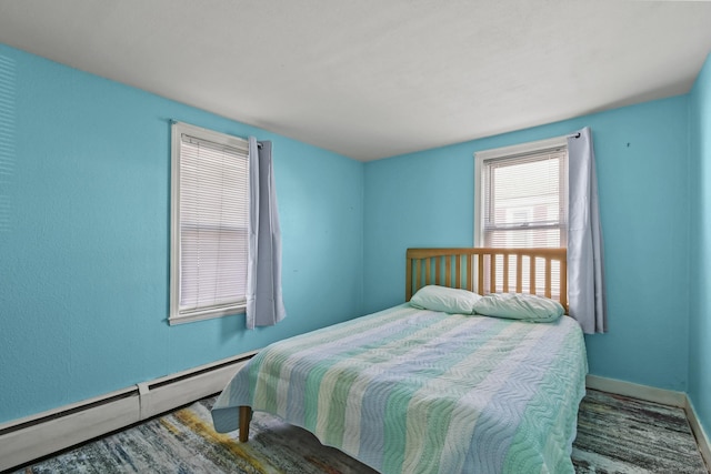 bedroom featuring baseboards and baseboard heating