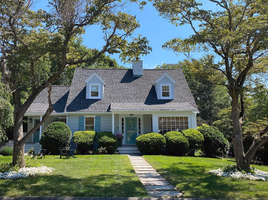 14 Knollwood Dr, Fairfield, CT 06824 - cape cod house with a front yard and a shingled roof