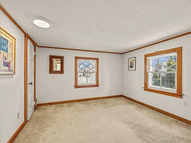 5 Old Pawson Rd, Branford, CT 06405 - spare room with crown molding, light colored carpet, and baseboards