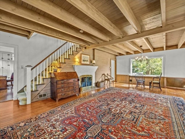 5 Old Pawson Rd, Branford, CT 06405 - living area with visible vents, wood ceiling, stairs, and hardwood / wood-style flooring