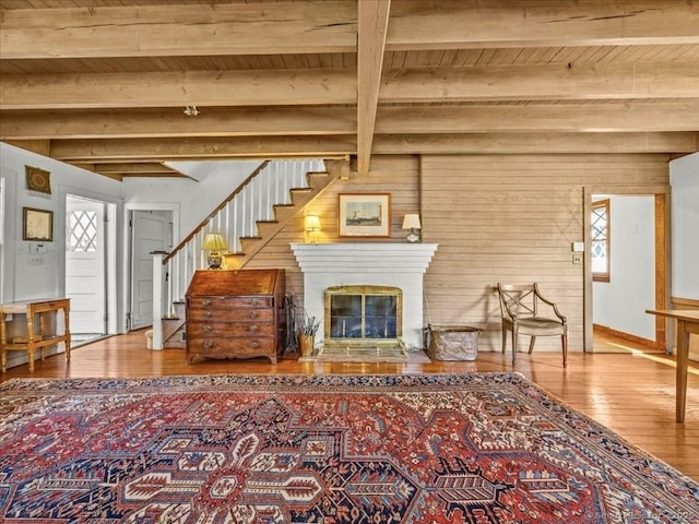 5 Old Pawson Rd, Branford, CT 06405 - living area with stairs, beam ceiling, a healthy amount of sunlight, and wood-type flooring