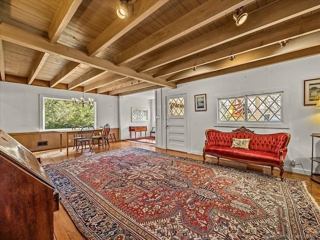 5 Old Pawson Rd, Branford, CT 06405 - sitting room featuring beamed ceiling, wood finished floors, wooden ceiling, rail lighting, and a chandelier
