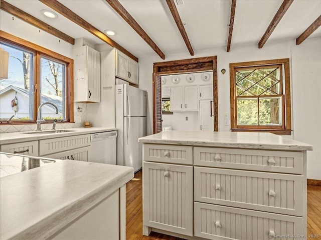 5 Old Pawson Rd, Branford, CT 06405 - kitchen featuring a sink, white appliances, tasteful backsplash, and a wealth of natural light