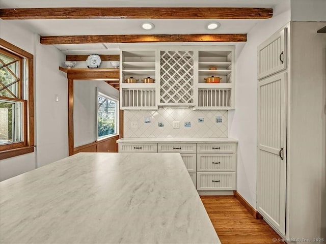 5 Old Pawson Rd, Branford, CT 06405 - kitchen with backsplash, light countertops, beam ceiling, light wood-style floors, and open shelves