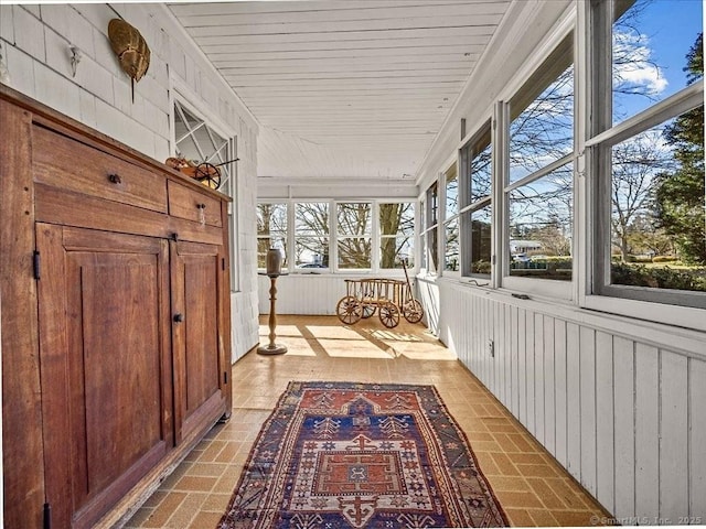 5 Old Pawson Rd, Branford, CT 06405 - unfurnished sunroom featuring plenty of natural light, wood ceiling, and brick floor