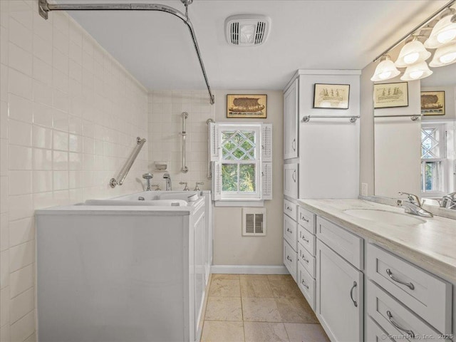 5 Old Pawson Rd, Branford, CT 06405 - bathroom featuring vanity, tile walls, a bath, and visible vents