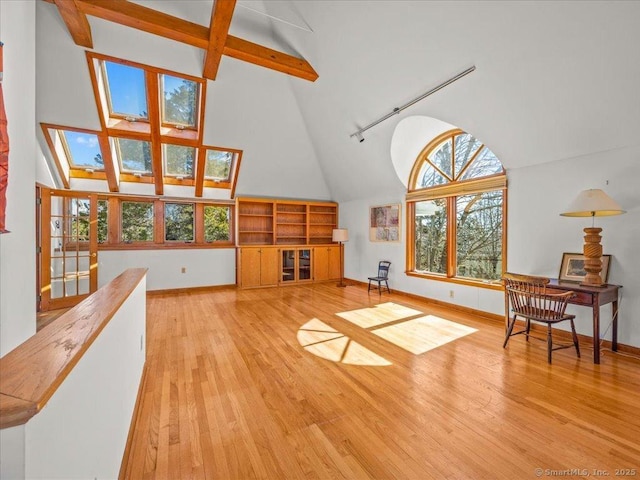 5 Old Pawson Rd, Branford, CT 06405 - living room featuring wood finished floors, baseboards, and high vaulted ceiling