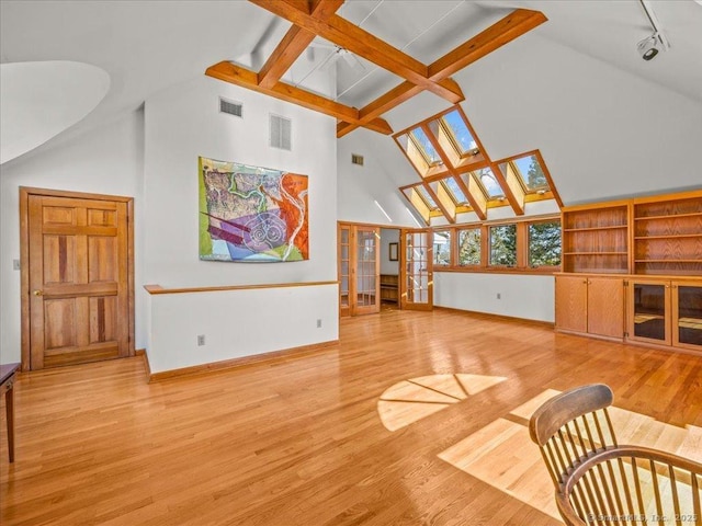 5 Old Pawson Rd, Branford, CT 06405 - living area featuring a skylight, light wood-style floors, visible vents, and baseboards