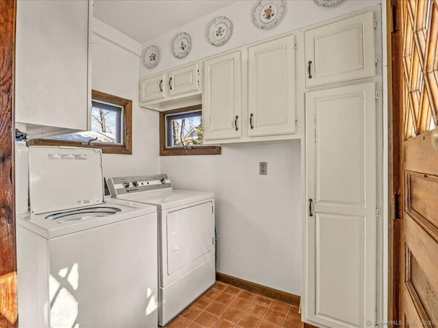 5 Old Pawson Rd, Branford, CT 06405 - clothes washing area featuring tile patterned floors, cabinet space, baseboards, and washing machine and clothes dryer