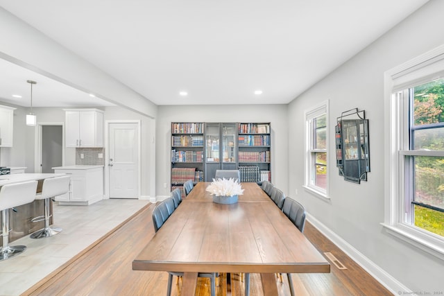 dining area featuring recessed lighting, light wood-type flooring, baseboards, and visible vents