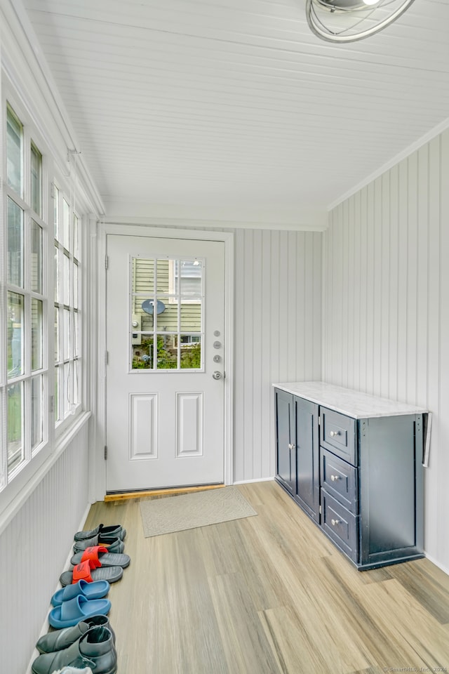 unfurnished sunroom featuring plenty of natural light