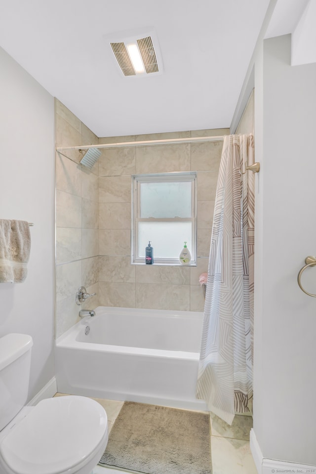 bathroom with visible vents, toilet, shower / tub combo with curtain, tile patterned flooring, and baseboards