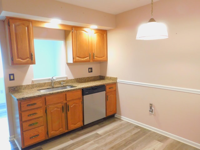 201 Windgate Cir Unit A, Monroe, CT 06468 - kitchen with dishwasher, a sink, light wood-style flooring, pendant lighting, and light stone countertops