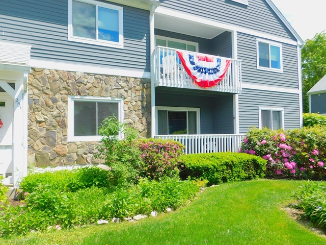 201 Windgate Cir Unit A, Monroe, CT 06468 - view of side of property with a balcony, stone siding, and a lawn