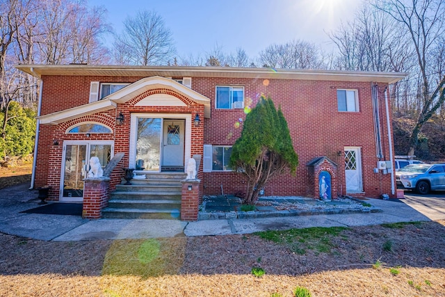 view of front of house featuring brick siding