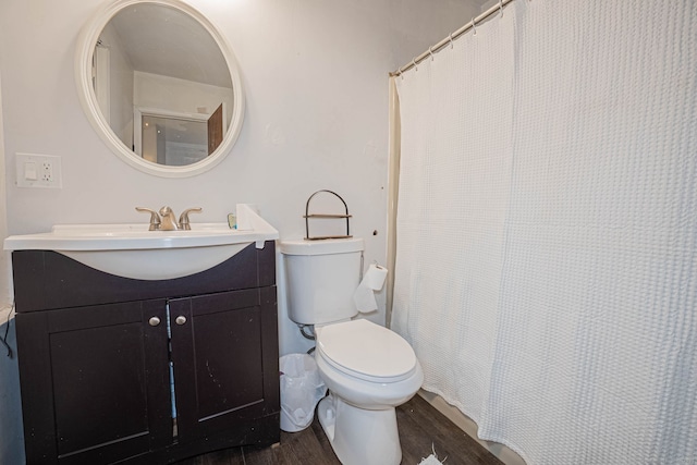 full bathroom with toilet, vanity, a shower with curtain, and wood finished floors