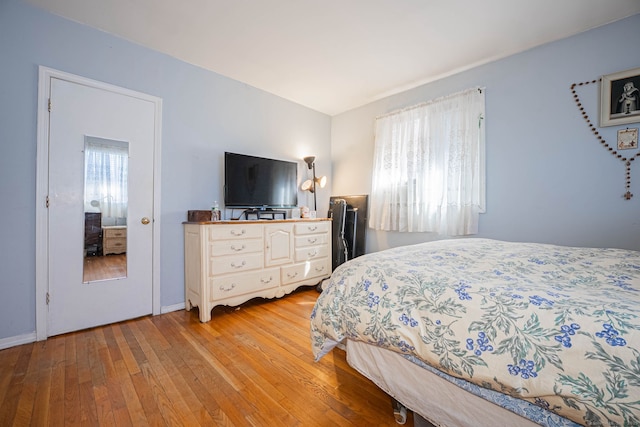 bedroom with light wood-type flooring