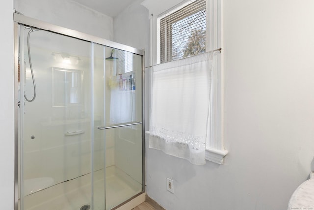 bathroom with a shower stall