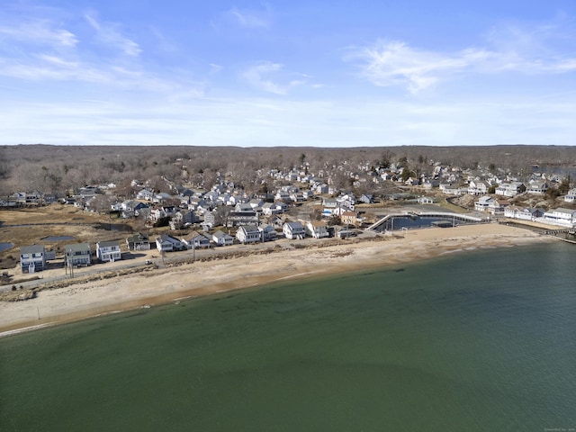 drone / aerial view featuring a residential view and a water view