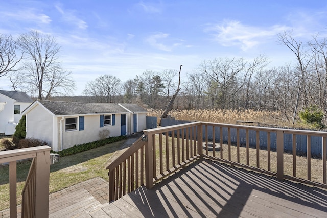 wooden terrace with an outbuilding