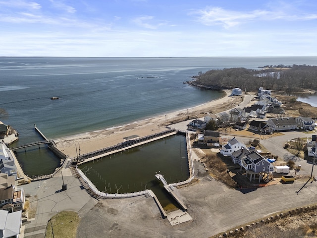 bird's eye view with a beach view and a water view