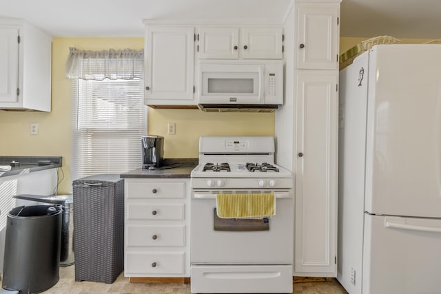 31 Old Colony Rd, Old Lyme, CT 06371 - kitchen with dark countertops, white cabinetry, and white appliances