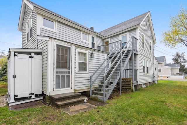 31 Old Colony Rd, Old Lyme, CT 06371 - rear view of property featuring a lawn, stairway, and entry steps