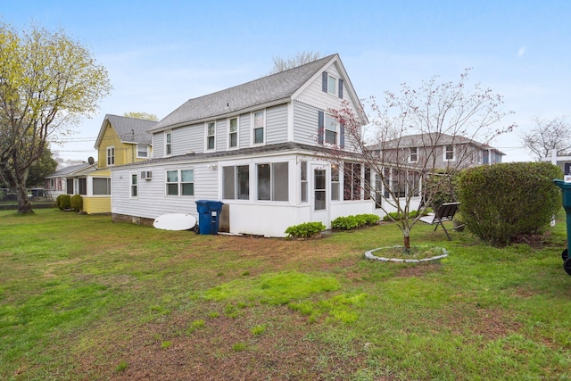 31 Old Colony Rd, Old Lyme, CT 06371 - back of property featuring roof with shingles, a yard, and a sunroom