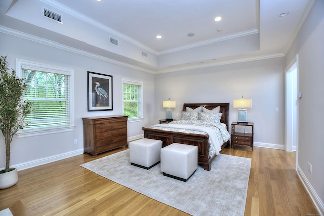 bedroom with light wood finished floors, baseboards, ornamental molding, and recessed lighting