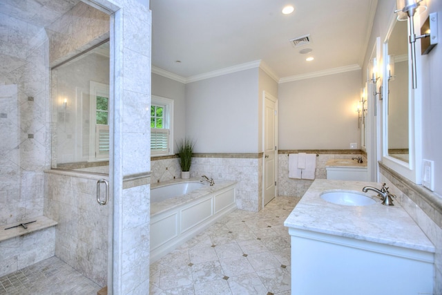 full bath with a stall shower, a garden tub, ornamental molding, vanity, and recessed lighting