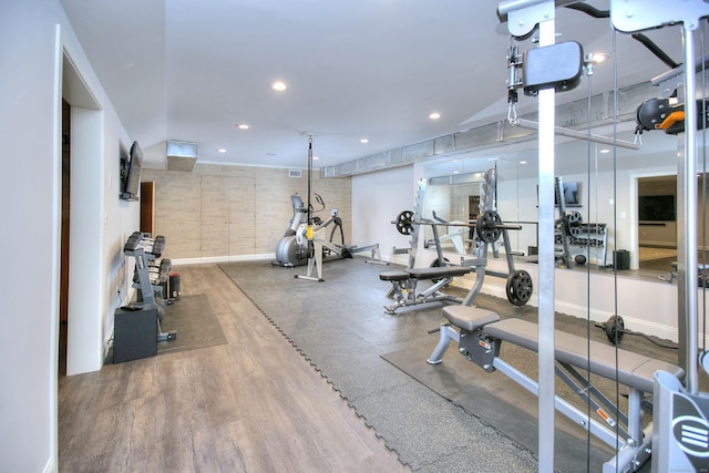 workout area featuring recessed lighting and baseboards