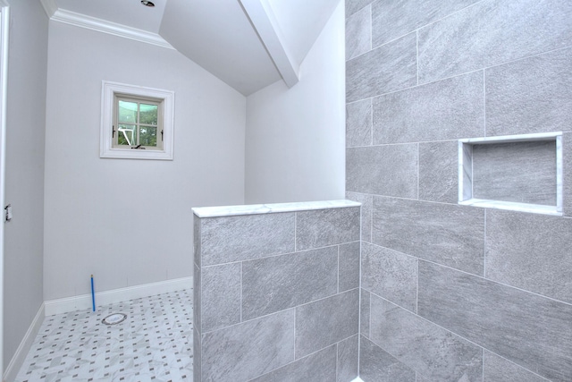 full bathroom featuring ornamental molding, a tile shower, baseboards, and lofted ceiling