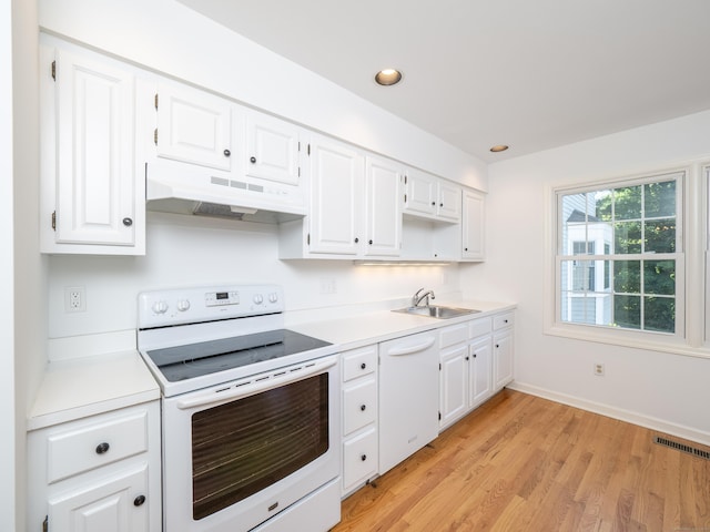 19 Prospect Rdg Apt 16, Ridgefield, CT 06877 - kitchen with white appliances, under cabinet range hood, white cabinetry, and recessed lighting