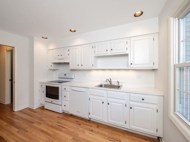 19 Prospect Rdg Apt 16, Ridgefield, CT 06877 - kitchen with white appliances, under cabinet range hood, healthy amount of natural light, light wood-style floors, and recessed lighting